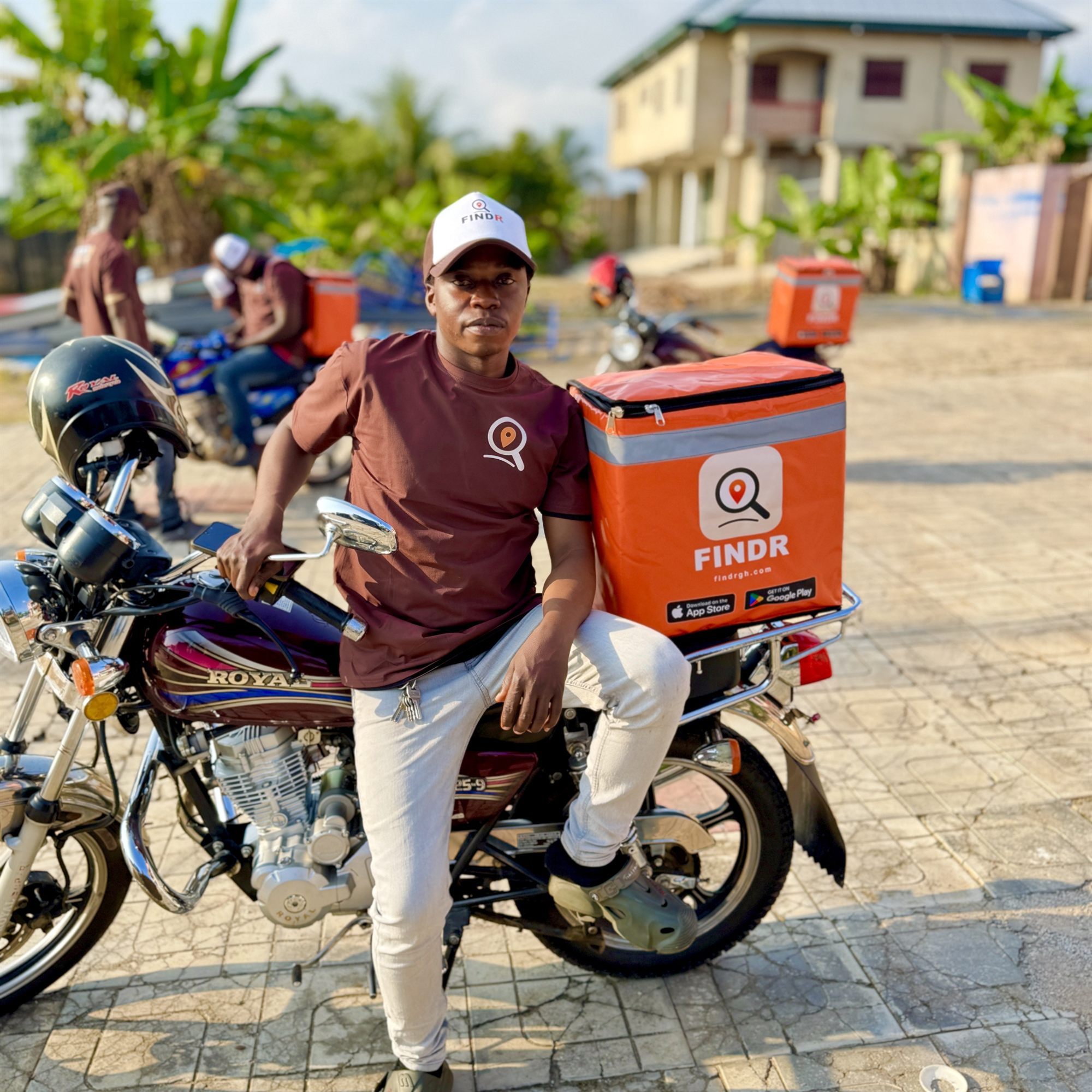 A FINDR driver seated on his motorbike, ready to ride